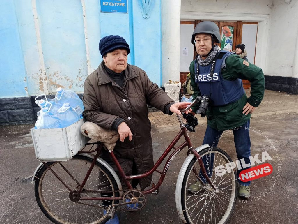 A Japanese film crew covers the war in Ukraine in protective gear from NUJU